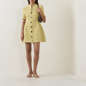 Model wearing Odd Muse Boucl&eacute; Tailored Mini Dress in chartreuse with front button fastening and flared skirt, styled with white flat sandals and a