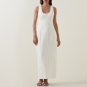 Model wearing Odd Muse Volume Sculpted Dress in ecru, sleeveless scoop neckline, midi length with dart detailing, styled with brown strappy sandals