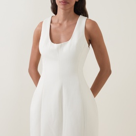 Model wearing Odd Muse Volume Sculpted Dress in ecru, featuring scoop neckline, sleeveless silhouette and waist-cinching dart detailing.
