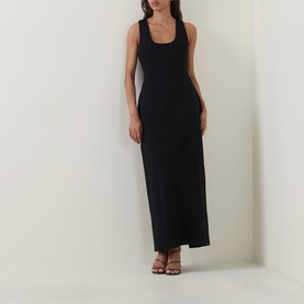 Model wearing Odd Muse Volume Sculpted Dress in black, sleeveless midi length with scoop neckline and waist cinch, styled with strappy heeled sandals