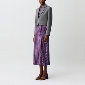 Model wearing Claude Pierlot Womens French Dress in mottled grey, styled with purple geometric-print midi skirt and brown leather sandals