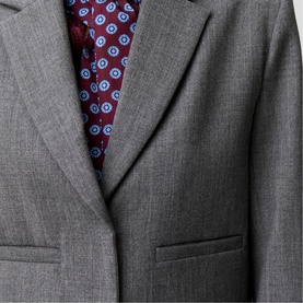 Claude Pierlot mottled grey tailored blazer close-up, notch lapel and welt pockets, styled with burgundy floral print tie