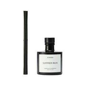 Byredo Summer Rain home diffuser with black reed sticks and dark glass bottle with white label