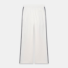 White wide-leg trousers with contrast navy side stripe detail and elasticated waistband, laid flat