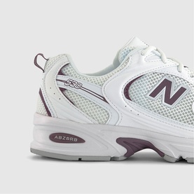New Balance 530 trainer in white and brown, with mesh upper, purple N logo, chunky white sole and ABZORB midsole detail