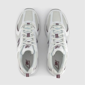 New Balance 530 trainers in white and brown, overhead view showing mesh upper, logo branding and white lace-up detailing