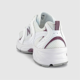 New Balance 530 trainer in white and brown, rear three-quarter view showing mesh upper, burgundy N logo, and chunky white sole.