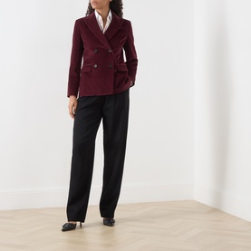 Model wearing Max Mara Weekend Bordeaux cotton blazer, double-breasted with patch pockets, styled with black trousers and heels.