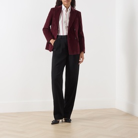 Model wearing Max Mara Weekend Bordeaux cotton blazer, styled with white shirt, black wide-leg trousers and black heels.