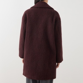 Model wearing Max Mara Weekend bordeaux boucl&eacute; wool blend coat, shown from the back, featuring a relaxed fit and wide lapels.