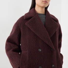 Model wearing Max Mara Weekend bordeaux double-breasted wool blend coat with wide lapels and dark buttons, styled with grey top.