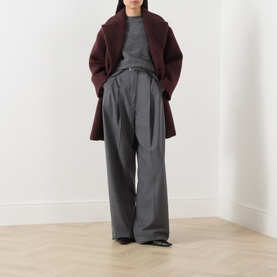 Model wearing Max Mara Weekend bordeaux wool blend coat, styled with grey wide-leg trousers and grey knit top.