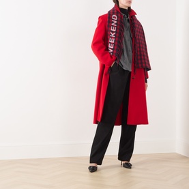 Model wearing Max Mara Weekend red wool coat with plaid scarf, styled with black trousers and dark top