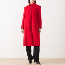 Model wearing Max Mara Weekend red wool single-breasted longline coat with button front, styled with black wide-leg trousers.