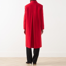 Model wearing Max Mara Weekend red wool coat, back view, with black wide-leg trousers and black heels