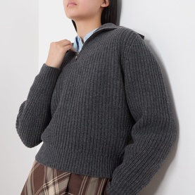 Model wearing Max Mara Weekend dark grey ribbed virgin wool knit sweater with collar detail, styled with blue shirt and check skirt