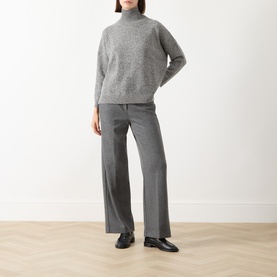 Model wearing Max Mara Weekend Borgia High Neck Sweater in medium grey wool, styled with matching grey wide-leg trousers and black loafers.