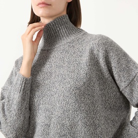 Model wearing Max Mara Weekend Borgia High Neck Sweater in medium grey, featuring ribbed high neckline and long sleeves in 100% virgin wool.