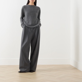 Model wearing Max Mara Weekend dark grey wool-cashmere knit sweater with wide-leg tailored trousers in matching grey tone.
