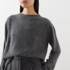 Model wearing Max Mara Weekend dark grey wool-cashmere crew neck jumper, styled with wide-leg trousers and belt.