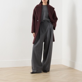 Model wearing Max Mara Weekend Dark Grey knit top, styled with burgundy wool coat and wide-leg charcoal trousers.