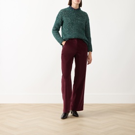 Model wearing Max Mara Weekend Hobby Knitted Sweater in dark green textured knit with crew neck, styled with burgundy wide-leg trousers and black