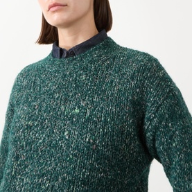 Model wearing Max Mara Weekend Hobby Knitted Sweater in dark green textured knit with crew neck, styled over a navy collared shirt.