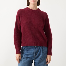 Model wearing Max Mara Weekend Tuono Knitted Sweater in Bordeaux, crew neck, long sleeves, ribbed trims, styled with blue jeans.