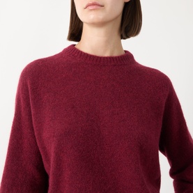 Model wearing Max Mara Weekend Tuono Knitted Sweater in Bordeaux, featuring crew neckline and ribbed trims, alpaca blend