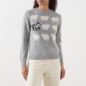 Model wearing Max Mara Weekend light grey knit jumper with intarsia sheep and wolf motif, styled with cream trousers