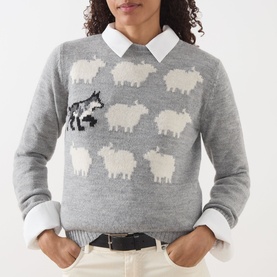 Model wearing Max Mara Weekend light grey knit jumper with wolf and sheep intarsia pattern, styled with white collared shirt and cream trousers