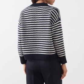 Model wearing Max Mara Weekend navy and white striped wool knit jumper, rear view, styled with navy wide-leg trousers.