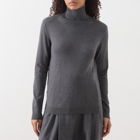 Model wearing Max Mara Weekend Kiku Turtleneck Sweater in dark grey, fine ribbed roll neck, long sleeves, styled with wide-leg trousers.