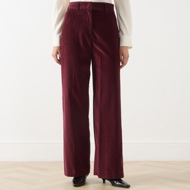 Model wearing Max Mara Weekend Tania Corduroy Straight-Leg Trousers in Bordeaux, styled with a white blouse and black shoes.