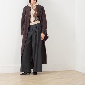 Model wearing Max Mara Weekend Dark Grey virgin wool wide-leg trousers, styled with a brown longline coat and argyle knit vest.