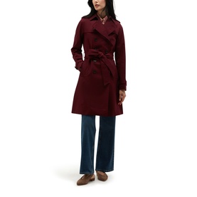 Model wearing Hobbs fig purple belted trench coat with wide-leg blue jeans and brown loafers