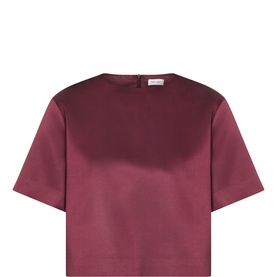 Soft Goat silk blouse in bordeaux, boxy cropped fit, short sleeves, crew neck, button back detail, no model.