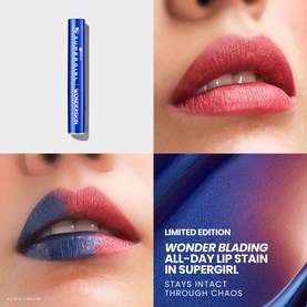 Wonderskin Wonder Blading All-Day Lip Stain in Supergirl, limited edition blue tube shown with model's lips in pink-blue shade