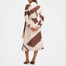 Model wearing Forever New Driftwood Geo midi dress with geometric colour-block print in cream and brown, long sleeves, back view.
