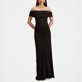 Model wearing Forever New black off-shoulder maxi dress with ruched bodice, corseted waist detail and floor-length skirt.