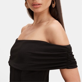 Model wearing Forever New black off-shoulder ruched sleeve dress, close-up detail of neckline and sleeve