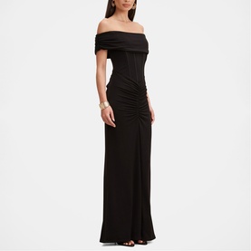 Model wearing Forever New black off-shoulder ruched maxi dress with corseted bodice and floor-length skirt