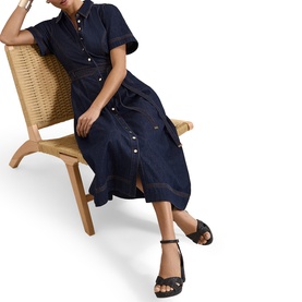 Model wearing Phase Eight blue midi shirt dress with button front, short sleeves and tie waist, styled with black block-heel sandals