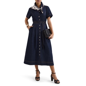 Model wearing Phase Eight blue denim midi shirt dress with button front, puff sleeves, styled with printed scarf, black clutch bag and heeled sandals