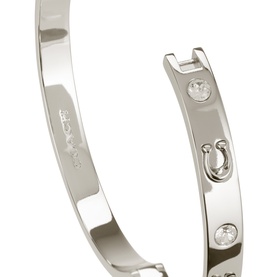 Coach Hinge Bangle Bracelet in rhodium with silver-tone finish, cubic zirconia stones, horseshoe charm and hinge closure detail