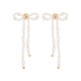 Coach Bow Pearl Drop Stud Earrings in pearl and gold-tone brass, featuring faux pearl bow motif with dangling pearl chain drops