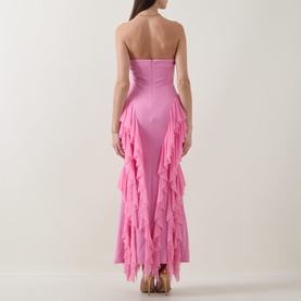 Model wearing Elliatt pink strapless gown with cascading ruffle skirt, back view