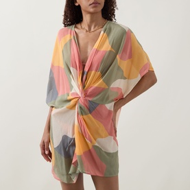 Model wearing Eres Nuance Printed Kaftan in multi colourway, featuring V-neckline, twist detail, short sleeves, and abstract print.