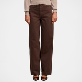 Model wearing Forever New chocolate wide-leg trousers with a cream knit top and black heeled mules.