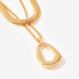 Mint Velvet gold layered necklace with snake chain, curb chain, and open teardrop pendant